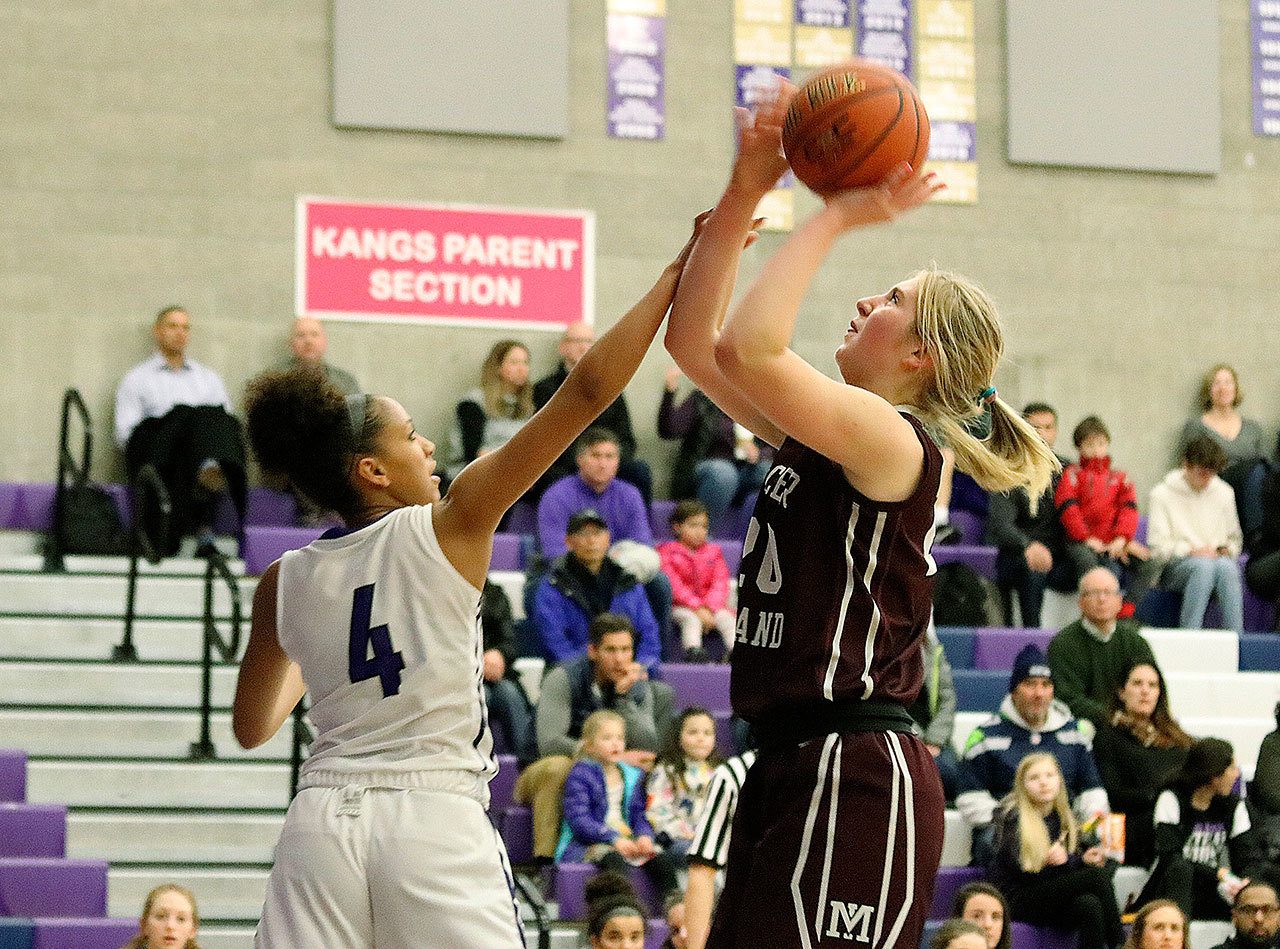 Mercer Island&rsquo;s Anna Luce, right, goes up for a shot against Lake Washington&rsquo;s Kathy Helf in January. Luce was recently named the KingCo 2A/3A league MVP (Joe Livarchik/staff photo).