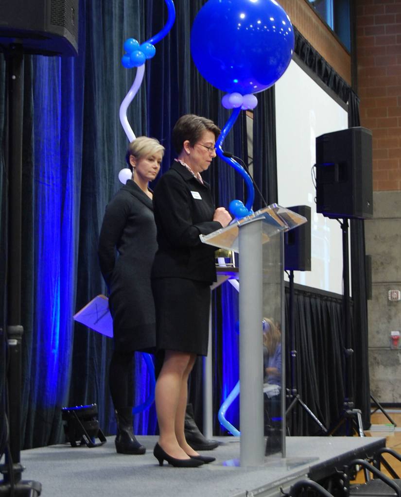 MIYFS Foundation Board President Pam Hinnen and MIYFS Department Director Cindy Goodwin address the crowd at the foundation&rsquo;s annual breakfast on Feb. 8. Katie Metzger/staff photo