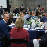 Mercer Island Mayor Bruce Bassett chats with City Council member Wendy Weiker and other community members during the breakfast. Katie Metzger/staff photo