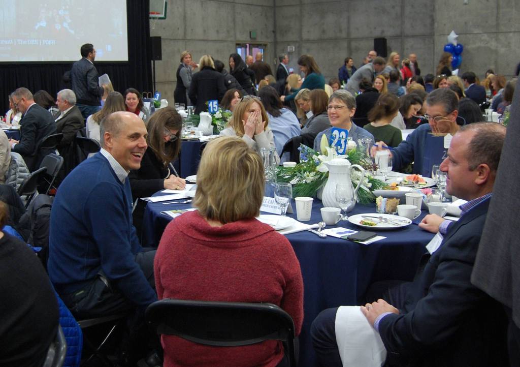 Mercer Island Mayor Bruce Bassett chats with City Council member Wendy Weiker and other community members during the breakfast. Katie Metzger/staff photo