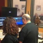 Broadcast media instructor Joe Bryant and program director Leah Raissis select songs to play in the first hour broadcasting as 88.9 The Bridge. Katie Metzger/staff photo