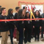 MIHS Principal Vicki Puckett helps cut the ribbon for the school&rsquo;s rebranded radio station. Katie Metzger/staff photo