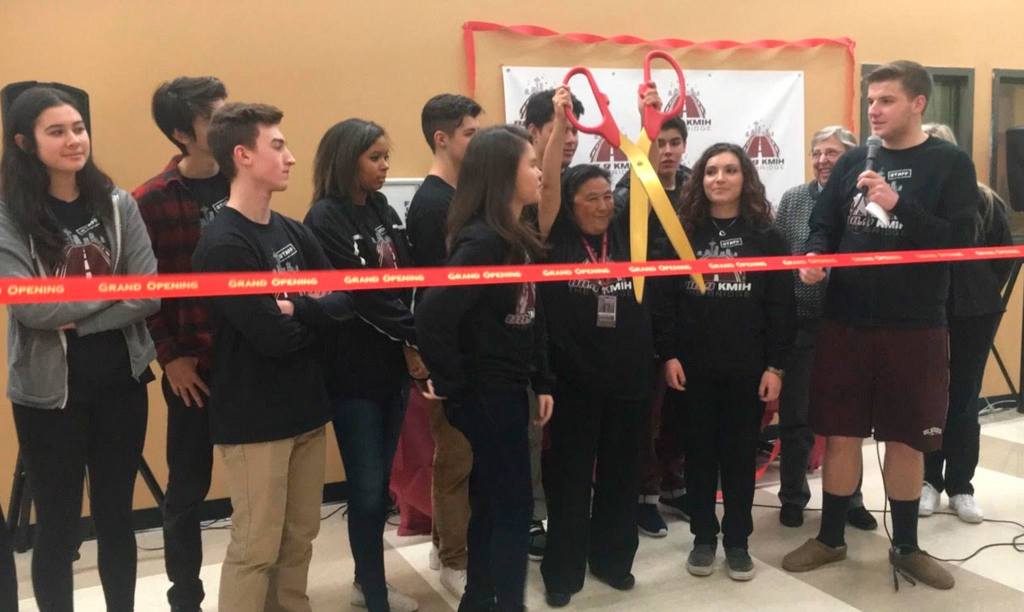 MIHS Principal Vicki Puckett helps cut the ribbon for the school&rsquo;s rebranded radio station. Katie Metzger/staff photo