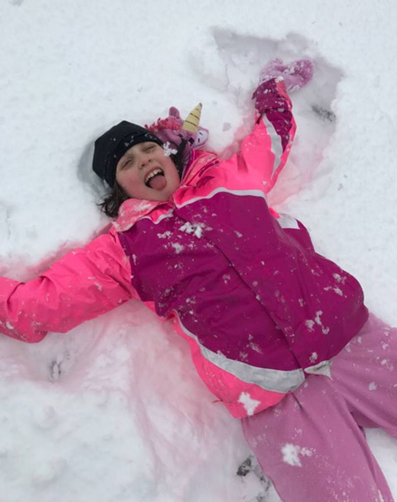 Sarah Simpson, 11, makes snow angels in Northwood playfield. Photo courtesy of Aurora Bearse