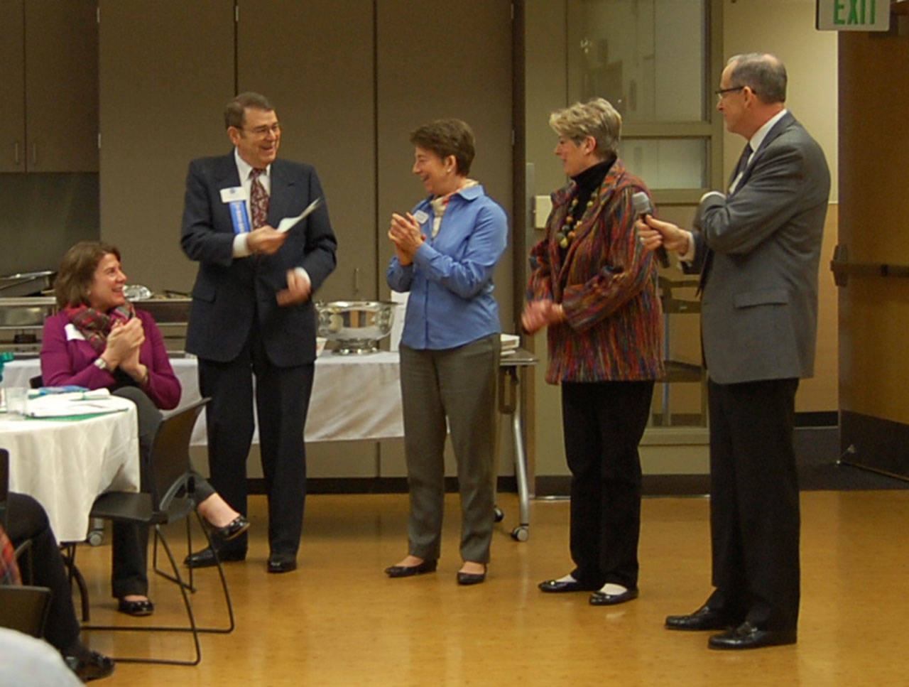 Mercer Island Chamber board member Emmett Maloof, Youth and Family Services Director Cindy Goodwin, retiring Chamber Director Terry Moreman and Chamber President Ralph Swanson laugh at the March 2 chamber luncheon. The community is invited to a reception for Moreman from 5:30-7:30 p.m. Thursday. Katie Metzger/staff photo