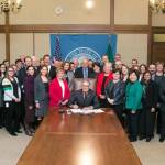 Gov. Jay Inslee signs Senate Bill No. 5023, relating to delaying implementation of revisions to the school levy lid and sponsored by Lisa Wellman (D-Mercer Island). Photos courtesy of Aaron Barna/Washington State Legislature