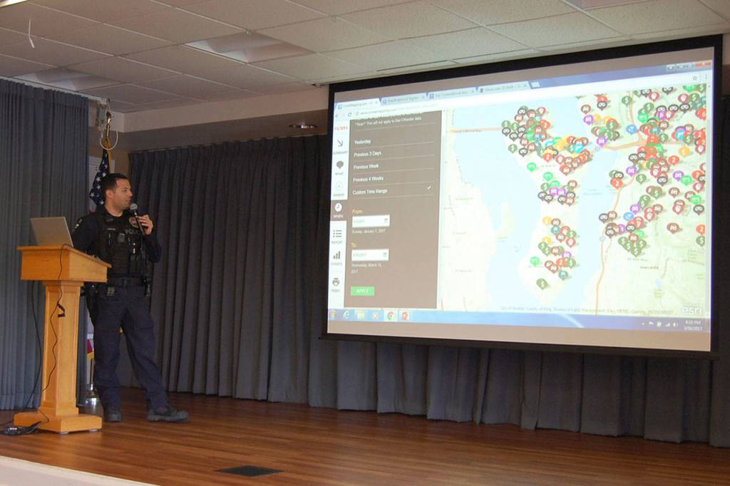 Cpl. David Canter of the Mercer Island Police Department shows a map of crimes reported in Mercer Island during a crime prevention information session at Covenant Shores on March 16. Katie Metzger/staff photo