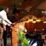 Seattle Seahawks defensive end Tylor Harris encourages Celebration of Youth luncheon attendees to contribute financially to support Friends of Youth. Samantha Pak/Redmond Reporter
