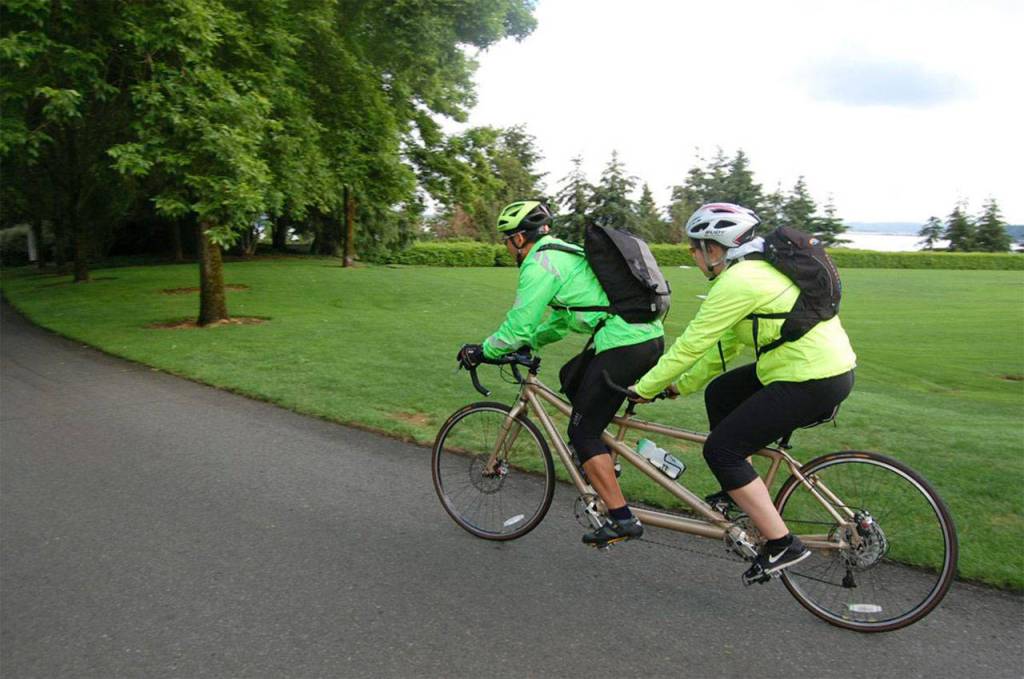 Cyclists ride a tandem bike on Mercer Island&rsquo;s Lid. File photo
