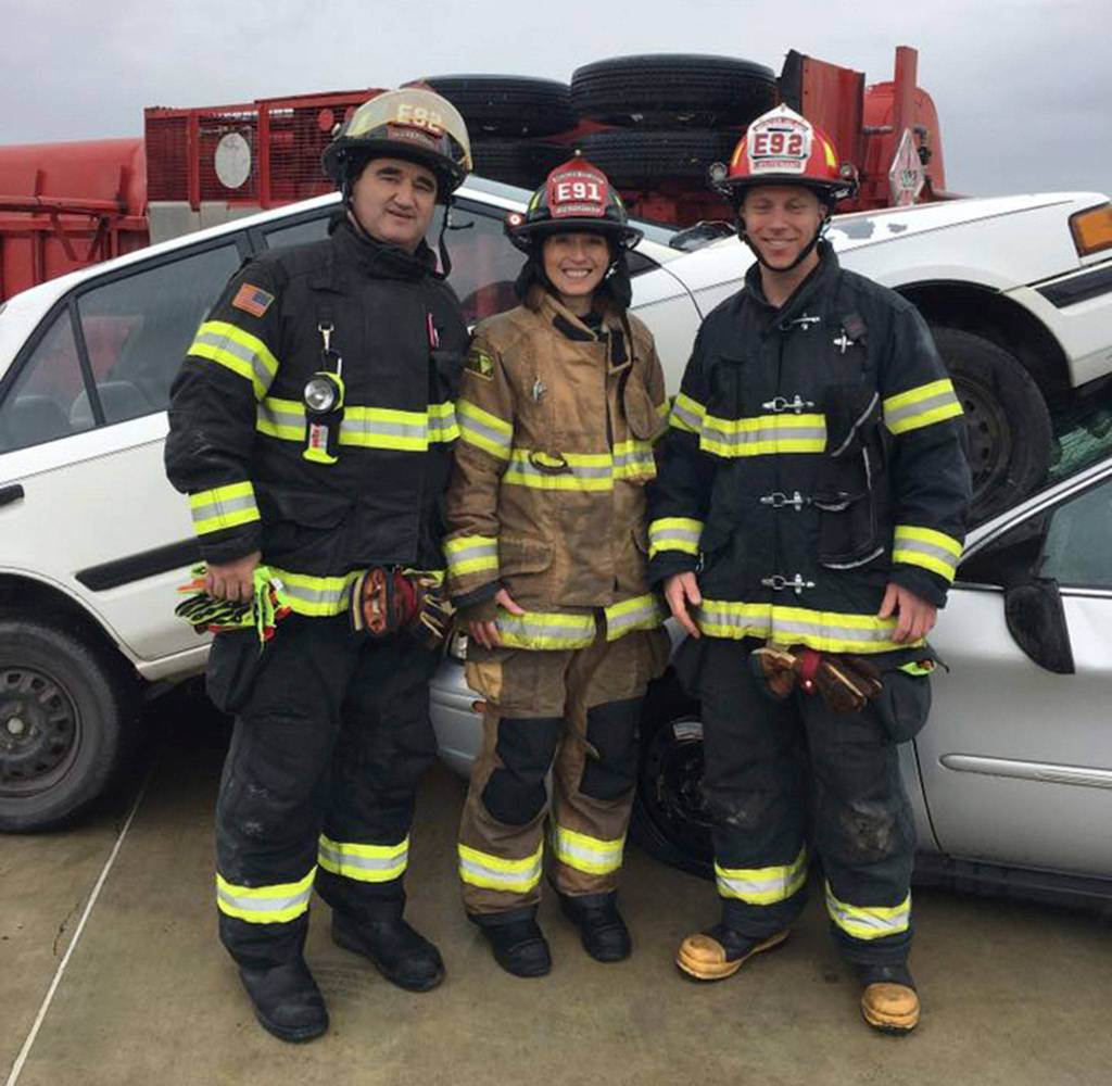 Julie Underwood poses with Mercer Island firefighter Ken Knott and MIFD Lt. Ray Austin. Photo courtesy of Ken Knott