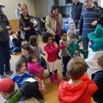 Leap, the fair&rsquo;s frog mascot, meets children and families at Saturday&rsquo;s sustainability fair. Katie Metzger/staff photo