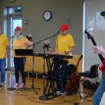 The Bus Boys, a band compromised of bus drivers for the Mercer Island School District, performs at the Leap for Green fair. &ldquo;Riding a school bus is a great way to go green,&rdquo; they said. Katie Metzger/staff photo