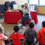 Mercer Island children&rsquo;s librarian Linda Ernst reads to a group of kids during story time at the Leap for Green fair. Katie Metzger/staff photo