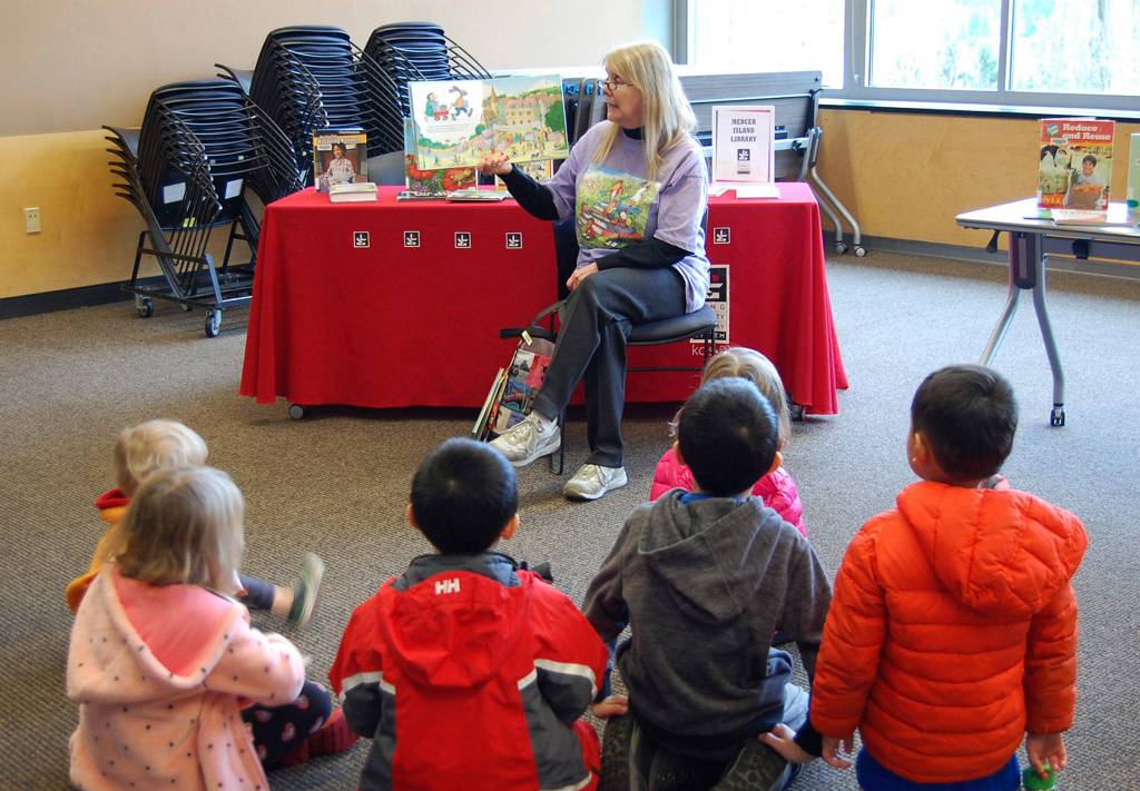 Mercer Island children&rsquo;s librarian Linda Ernst reads to a group of kids during story time at the Leap for Green fair. Katie Metzger/staff photo