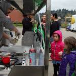 Kids watch as their Igloo Rolls ice cream is made in front of them at Saturday&rsquo;s Leap for Green fair. Katie Metzger/staff photo