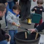 Island families play with organic composted soil, provided by Cedar Grove. Katie Metzger/staff photo