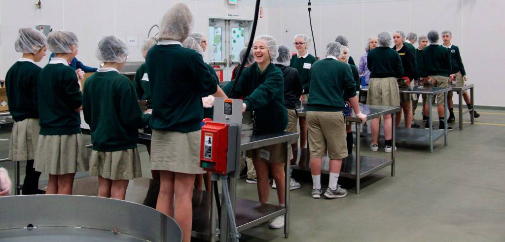 St. Monica Middle School students volunteer at Northwest Harvest. Photo courtesy of Krista Pittiglio