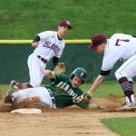 Photo courtesy of Jim Nicholson                                Mercer Island infielder Jack Smith, right, tags out a Redmond runner at second base. Mercer Island pounded out 12 hits in the win against Redmond on April 26.