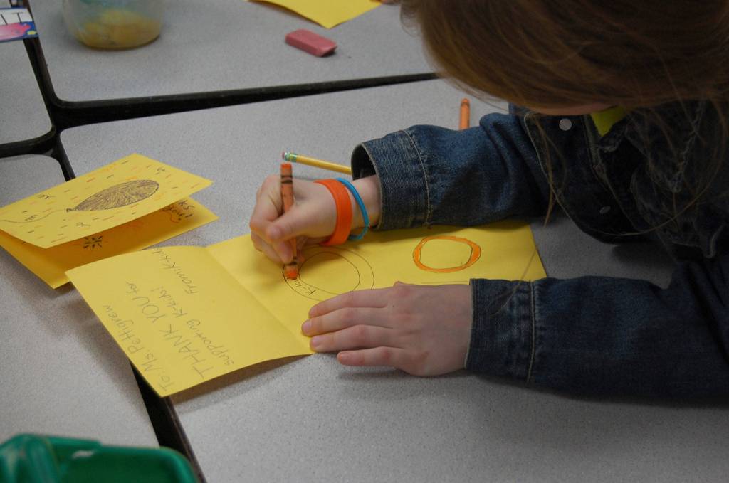 K-Kids write thank you cards for teachers and community members who helped them with their fundraising project at their May 4 meeting. Katie Metzger/staff photo