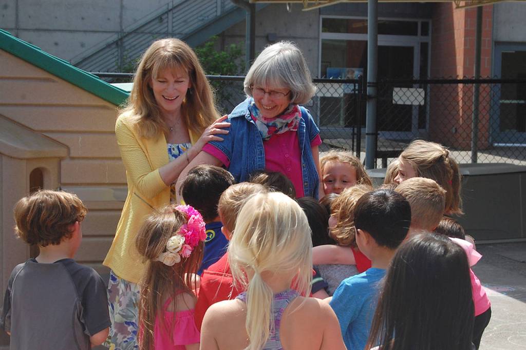 Miss Kathy gets a hug from a student at the Creative Learning Center after being surprised with MIPA&rsquo;s Exceptional Educator award. Katie Metzger/staff photo