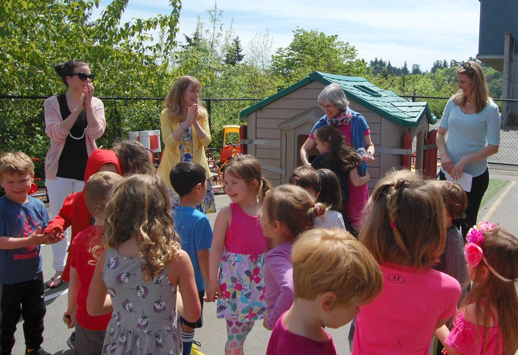 Kathy Morey receives a congratulatory hug from one of her students. Katie Metzger/staff photo