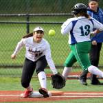 Photo courtesy of Jim Nicholson                                Liberty Patriots senior infielder Alexis Serna hustles to first base as Islanders first baseman Angelina Barokas waits for the ball to arrive. Barokas went 4-for-5 at the plate with 4 RBI in the contest. Liberty defeated Mercer Island 18-15 on May 5.