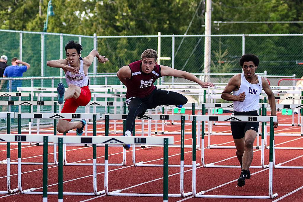 Photo courtesy of Rick Edelman/Rick Edelman Photography                                Mercer Island sophomore hurdler Jack Clayville, center, competed in the 110-meter hurdles at the Class 3A KingCo Championships on May 10 at Skyline High School in Sammamish. Clayville clocked a personal best time of 17.28 in the race. Mercer Island girls athletes competing in the KingCo 3A meet consisted of Maya Virdell (200, 400), Margaret Baker (400), Gretchen Blohm (400), Ella Hensey (400, long jump), Elizabeth Bailey (400), Chloe Michaels (1600), Mary Rose Vu (1600), Kendra Watson (100 hurdles, 300 hurdles), Peyton Bohlinger (100 hurdles, 300 hurdles), Katherine McCormick (300 hurdles), Leah Wootton (discus), Rose Weiker (pole vault), Elizabeth Bailey (pole vault), Aleksandra Kogalovski (pole vault) and Giulia Quarta Cas (long jump). Mercer Island boys competitors included Christopher Yee (200), Euan Dumont (800), Spencer Kingston (800), Jaelin Tate (400, long jump), Randall Schulz (800), Christian Avilez (800), Mitchell Kirby (110 hurdles, 300 hurdles), Charles Fischer (110 hurdles, 300 hurdles), Carl Carlens (300 hurdles), Andy Bliss (shot-put) and Teague Frazier (shot-put).