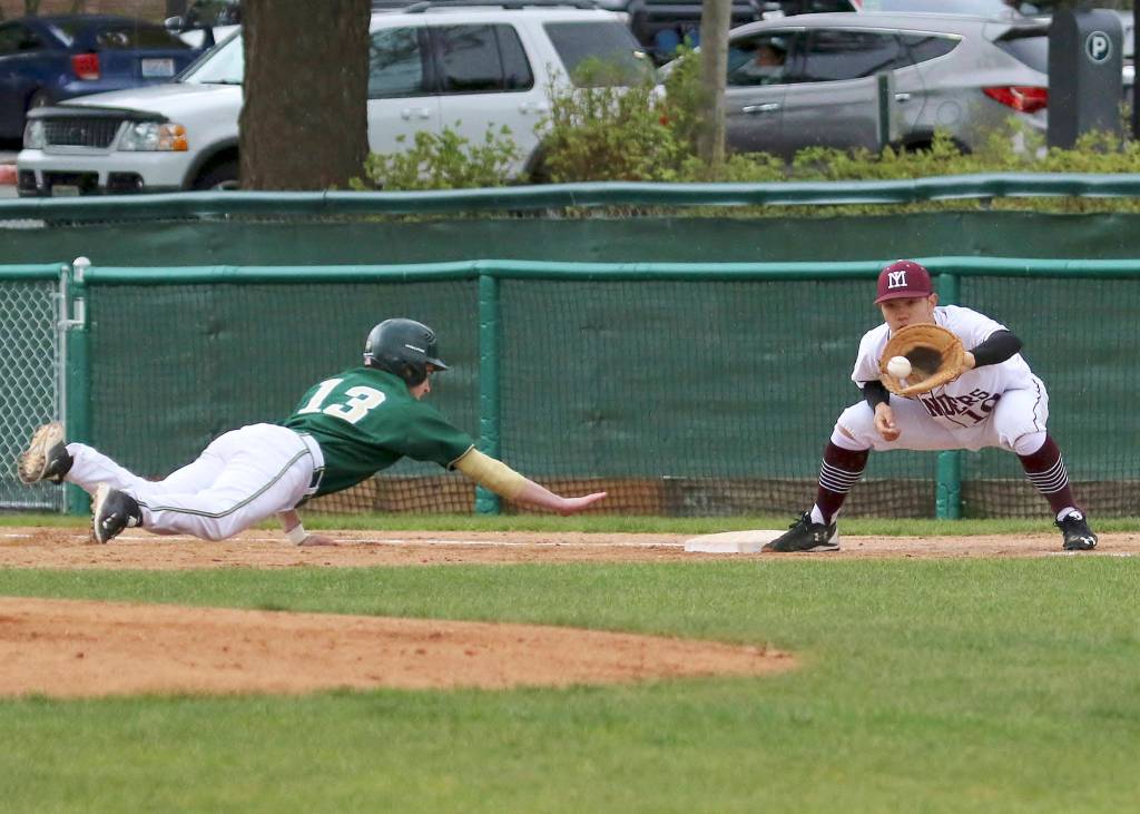 Photo courtesy of Jim Nicholson                                Mercer Island first baseman Justin Ho prepares to tag out Redmond base-runner Cameron Allen-Shipman in a contest on April 26 at Bellevue College. The Islanders have compiled an impressive 18-2 overall record thus far this season. The Islanders will compete in the first round of the Class 3A state tournament at 1 p.m. on May 20 at Bannerwood Park in Bellevue.