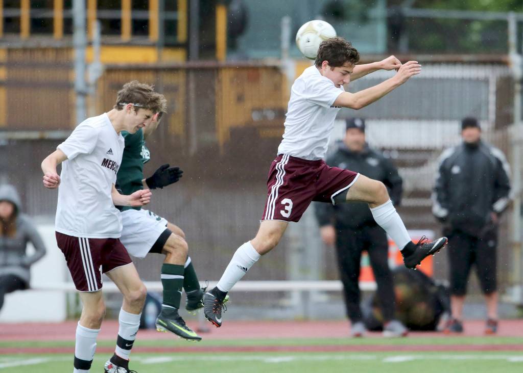 Photo courtesy of Jim Nicholson                                Mercer Island senior midfielder Mitchell Meade heads the ball in the first half of play against the Shorecrest Scots. Meade scored Mercer Island&rsquo;s fifth and final goal in the 79th minute of play.