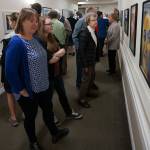 Artist and MIHS senior Rebecca Bone and her mother Carolyn (left) admire portraits at the MIVAL Jr. Lighthouse Gallery art show at Covenant Shores. Photo courtesy of Brandon Hill