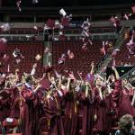 Mercer Island High School graduates toss their caps in the air. Photo courtesy of David Cummings
