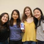 Valentina Muti, Zoe Sheill, Katherine Gelsey and Emily Kim show off the homescreen of their WeTutor app on June 9. Katie Metzger/staff photo