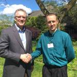 Covenant Shores Executive Director Bruce Erickson congratulates employee Brian Vanderkooy on his scholarship. Photo courtey of Covenant Shores