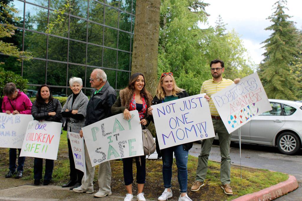 Parents and community members protest the Bellevue School Board&rsquo;s decision to implement crumb rubber infill on its artificial turf fields during the board&rsquo;s May 16 meeting. Both the city and school district in Mercer Island are facing the same issue. Madison Miller/Bellevue Reporter
