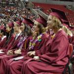 Mercer Island High School seniors listen to a speech from teacher Chris Twombley at graduation on June 8. Twombley &ldquo;hypnotized&rdquo; the crowd and told them to hold hands. He also told them to suspend their disbelief, be receptive to new ideas and &ldquo;live curiously.&rdquo; Katie Metzger/staff photos