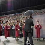 Students get their pictures taken before receiving their diplomas on stage at KeyArena. Katie Metzger/staff photo
