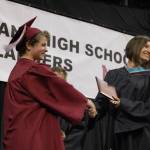 MIHS teacher Laura Totten presents Rachel Ayzenburg with her diploma at the June 8 commencement ceremony at Seattle&rsquo;s KeyArena. Katie Metzger/staff photo