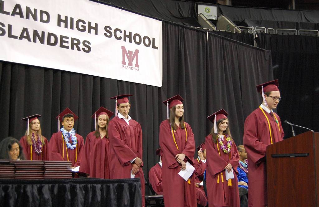 The seven valedictorians from Mercer Island High School &mdash; Charles Cuono II, Nikita Marcou, Rachel Motz, Hanna Puetz, Adam Tucker, Maxwell Van Gelder and Julia Wischman &mdash; give a speech called &ldquo;Insert Title Here.&rdquo; Other students who spoke at the ceremony were the senior class officers, Katerina Tiscornia and Luke Kenworthy, the school&rsquo;s ASB president and one of its seven salutatorians. Katie Metzger/staff photo