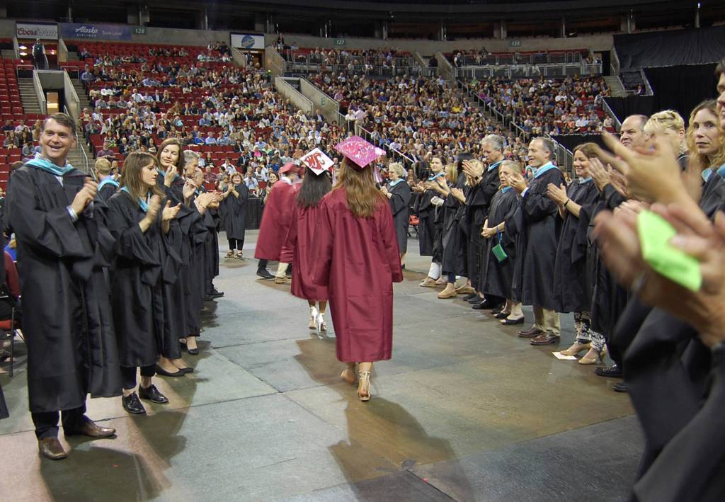 MIHS students walking into KeyArena for graduation are greeted by their teachers. Katie Metzger/staff photo