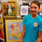 Sophia Scull, a sophomore at Mercer Island High School, stands next to her MI Florist Award winning acrylic painting &ldquo;Spring in the Meadow.&rdquo; Photo courtesy of Raleigh Nowers