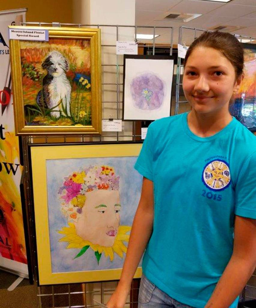 Sophia Scull, a sophomore at Mercer Island High School, stands next to her MI Florist Award winning acrylic painting &ldquo;Spring in the Meadow.&rdquo; Photo courtesy of Raleigh Nowers