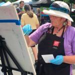 Surya Gaertner hosts a demonstration at the MIVAL tent during Summer Celebration. Photo courtesy of Lorri Falterman