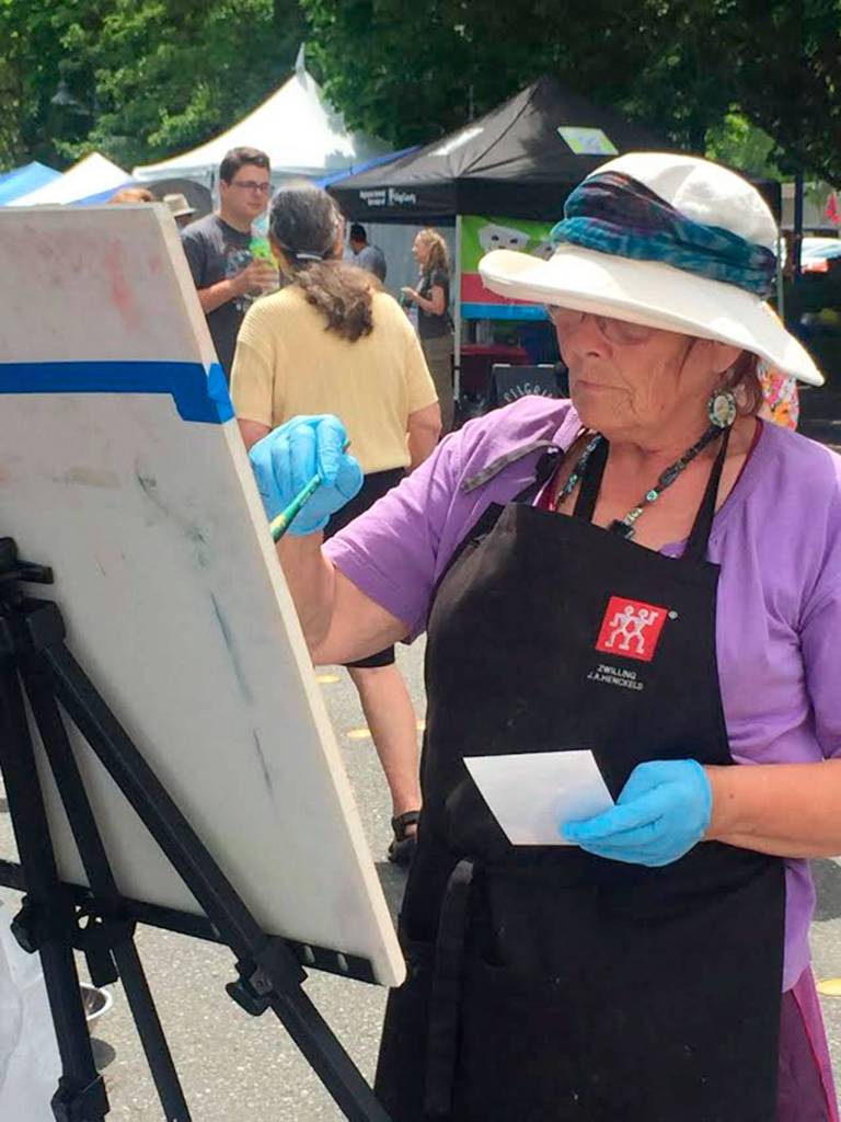 Surya Gaertner hosts a demonstration at the MIVAL tent during Summer Celebration. Photo courtesy of Lorri Falterman