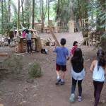 Adventure Playground has taken shape, with families, summer campers, city staff members and volunteers contributing to the village of wooden structures in Deane&rsquo;s Children&rsquo;s Park since it opened in June. Katie Metzger/staff photos
