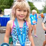Five-year-old McKenna Halter crosses the finish line. Photo courtesy of Swedish Seafair Triathlon