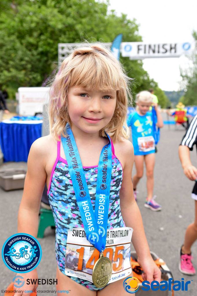 Five-year-old McKenna Halter crosses the finish line. Photo courtesy of Swedish Seafair Triathlon