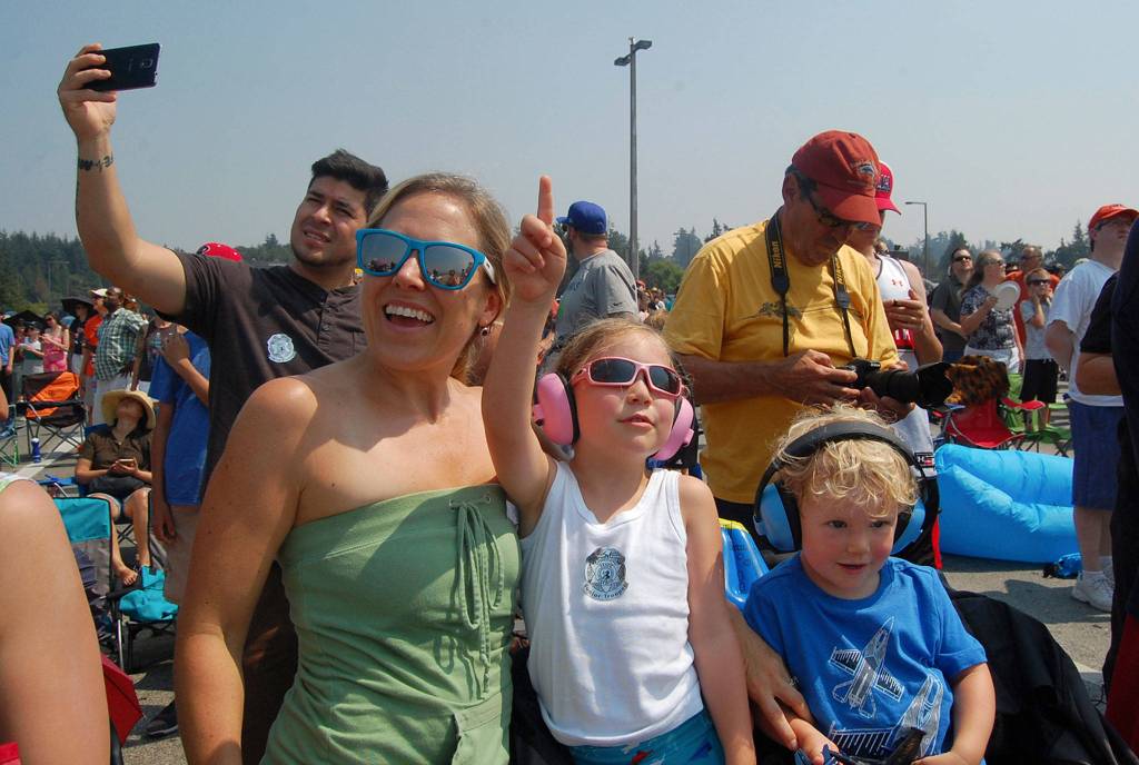 Sienna Woody, of Bellevue, points at the Blue Angels during their practice on Friday. Katie Metzger/staff photo