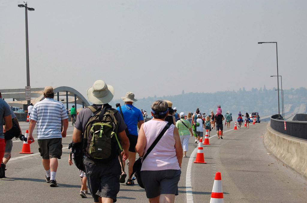 People walk out on the I-90 bridge to watch the Blue Angels fly over Lake Washington. The bridge is closed during the practices and performances. Katie Metzger/staff photo