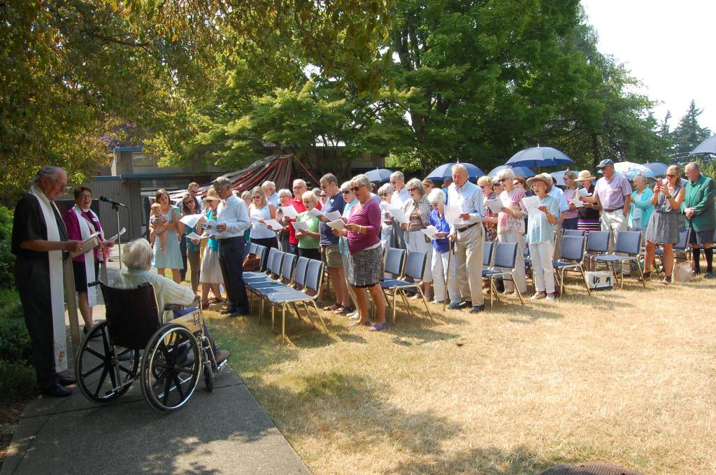 A crowd gathers on the lawn of Emmanuel Episcopal to celebrate Ruth Mary Close&rsquo;s 100th birthday. Katie Metzger/staff photo