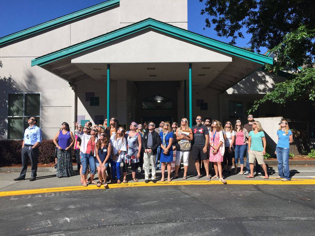 The eclipse coincided with a group science curriculum training for Mercer Island K-5 teachers at Island Park Elementary, who used the time to watch the eclipse along with new Superintendent Donna Colosky and Assistant Superintendent Fred Rundle. Photo courtesy of Craig Degginger/Mercer Island School District
